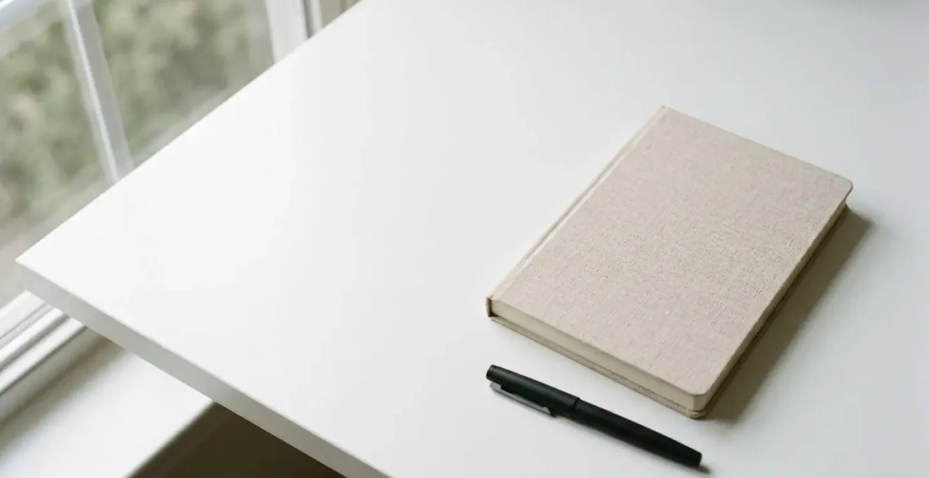 Minimalist wide shot of clean workspace suggesting healthcare assessment and decision-making
